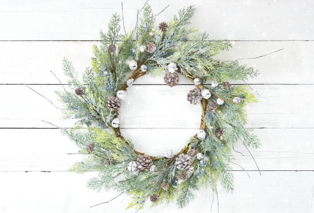 istock Christmas rustic wreath on an old white wood background 1285981968