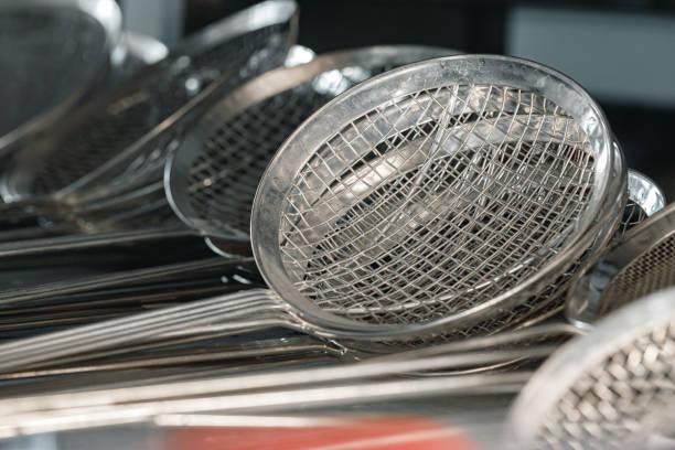 istock New metal kitchenware in a row close up 1285983157