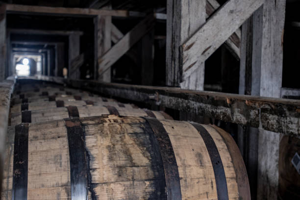 istock Long Lines of Bourbon Barrels in Racks 1285984819
