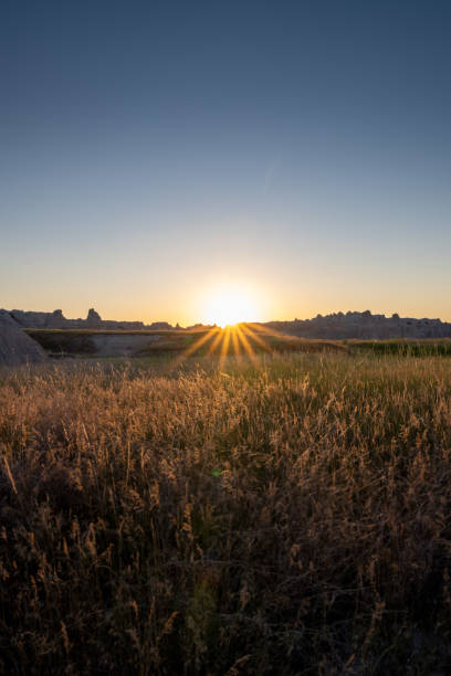 istock Sun Bursts Over Hoodoos to Light up Prairie 1285985525