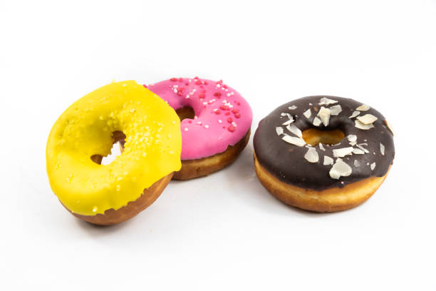 istock Several delicious multicolored donuts on white isolated background banner 1285985677