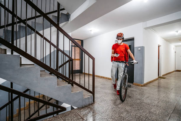 istock Delivery man checking the right address on his smart phone 1285985943