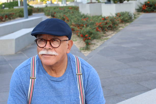 istock Pensioner wearing glasses close up 1285987854