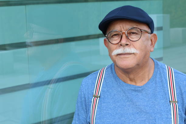 istock Pensioner wearing glasses close up 1285987877