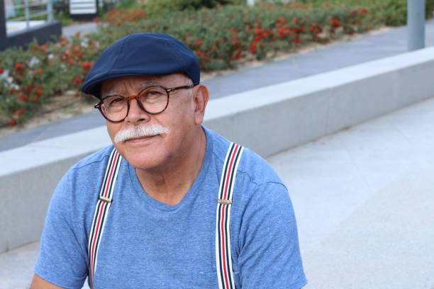istock Pensioner wearing glasses close up 1285987907