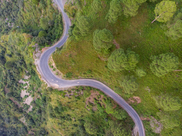 istock Aerial view of a road through the mountains 1285988048