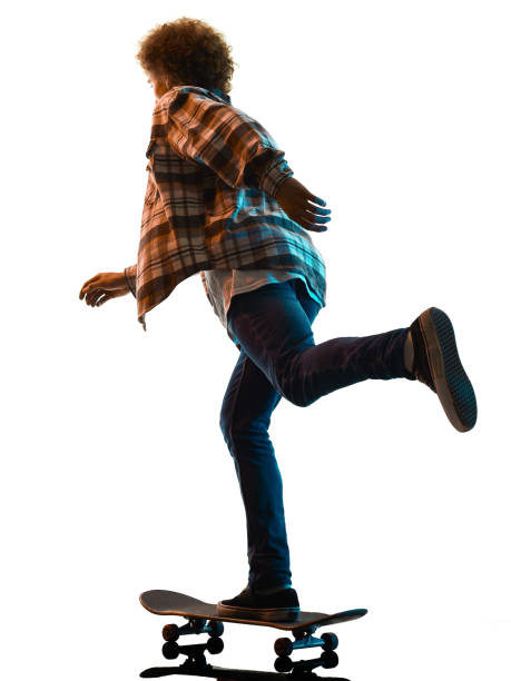 istock young man skateboarder Skateboarding   isolated white background shadow silhouette 1285988176