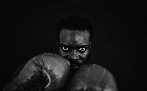 the fighter - posing looking at camera combative sport boxing fotografías e imágenes de stock