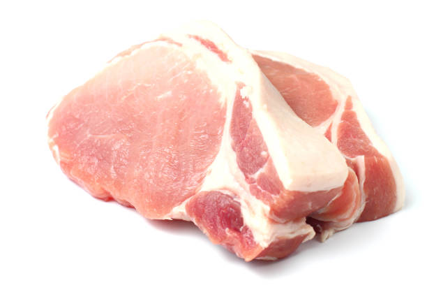 istock Raw pork meat steak closeup on a white background, isolate. 1285991039