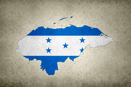Grunge map of Honduras with its flag printed within its border on an old paper.