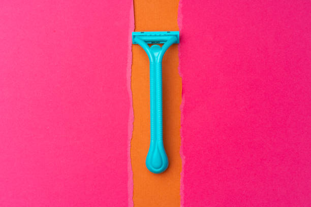 istock Female shaving razor on pink background top view 1285991259