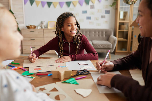 istock Smiling Girl Enjoying Art Class 1285993330