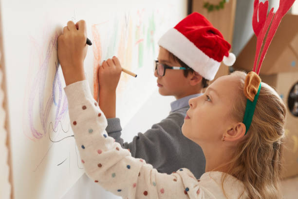 istock Girl Drawing on Walls on Christmas 1285993403