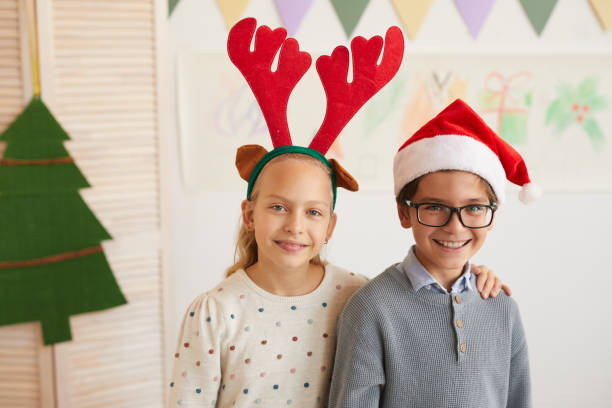 istock Brother and Sister Posing on Christmas 1285993406