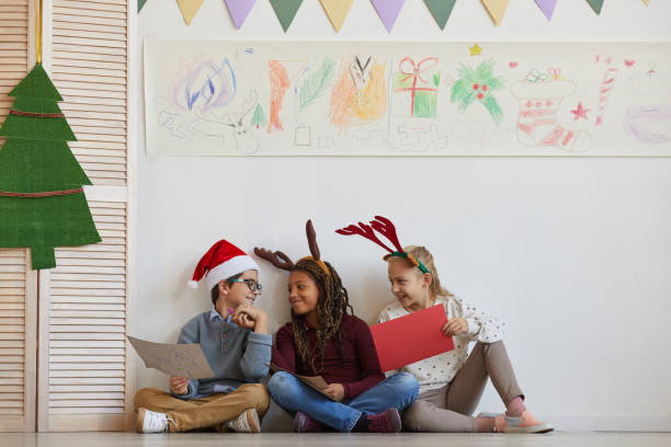 istock Kids Enjoying Christmas in School 1285993419