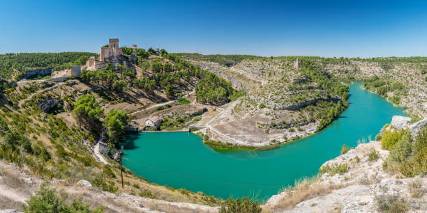 Panorama view of the famous fortified medieval town of Alarcon in Cuenca, Castilla-La Mancha, surrounded by the Jucar river.