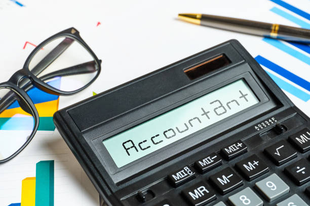 istock Concept accountant calculator with charts close up 1285994838
