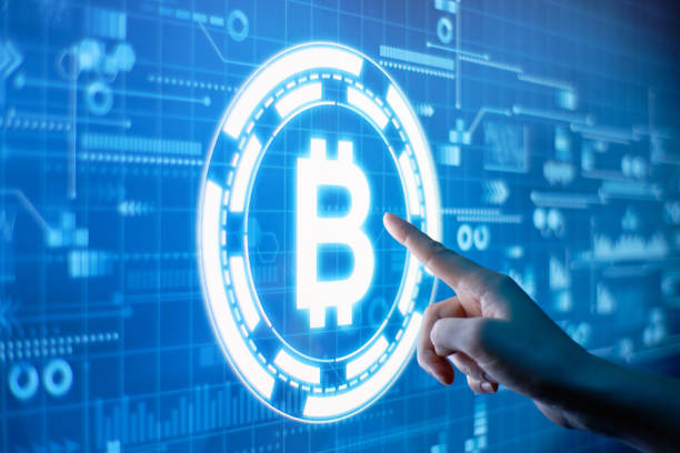 istock Hand clicks on futuristic display with bitcoin cryptocurrency image 1285994890