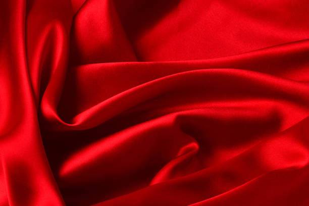 istock Red silk or satin luxury fabric texture can use as abstract background. Top view 1285995859