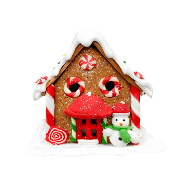 istock Christmas gingerbread house with caramel Windows and a snowman on a white background 1285998106