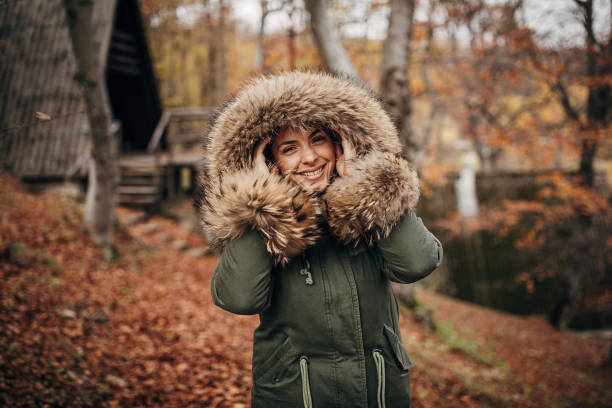 istock One cheerful woman in autumn forest 1285999048