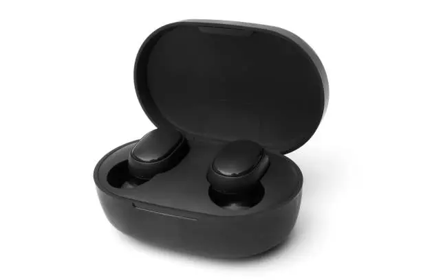 Photo of Black wireless earbuds inside power bank case