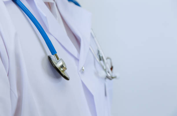 istock Doctor in a white coat, with a phonendoscope in medicine. 1285999490