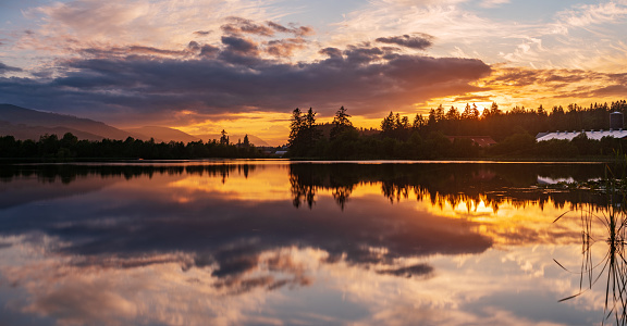Sunset and calm reflections in a lake near Duncan, BC, Vancouver Island.