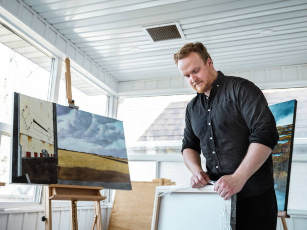 istock Man painting art in his studio 1286005300