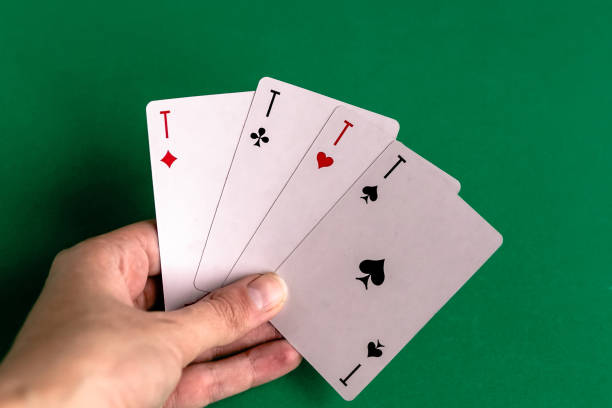 istock Poker quads playing card, green background 1286006162