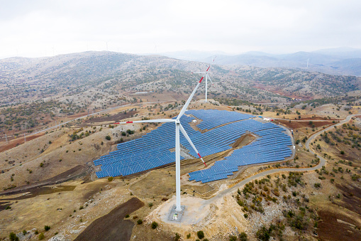 Aerial view of Wind Turbines and Solar Panel Farm in Kayseri Turkey. Taken via drone.