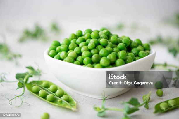 Fresh Green Peas With Greens And Pea Pods Stock Photo - Download Image Now - Green Pea, Agriculture, Curve