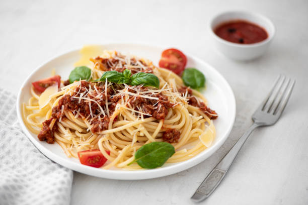 istock spaghetti with meat sauce, parmesan and basil 1286010538