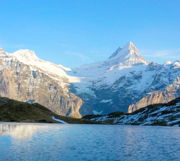 istock Fresh snowcapped mountains and reflection in lake 1286010731