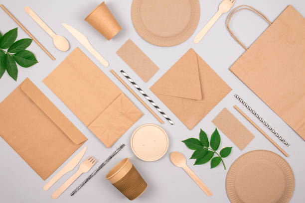 istock Flat lay composition with eco-friendly tableware - kraft paper food packaging on light grey background. Street food paper packaging, recyclable paperware, zero waste packaging concept. Mockup 1286011643