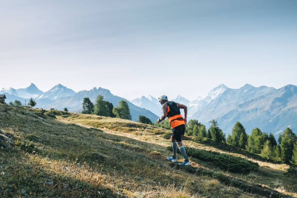 istock Senior man races along a trail in the mountains 1286011704