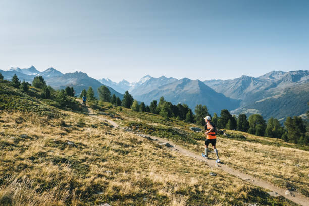 istock Senior man races along a trail in the mountains 1286011873