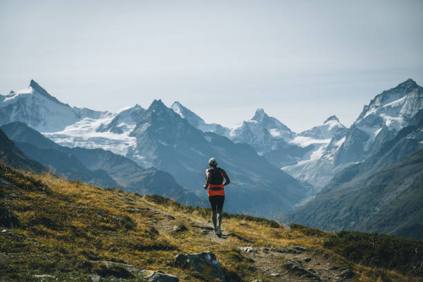 istock Senior man races along a trail in the mountains 1286011979