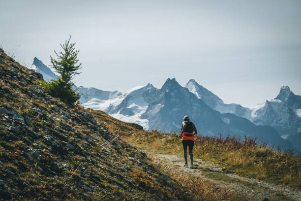 istock Senior man races along a trail in the mountains 1286012003