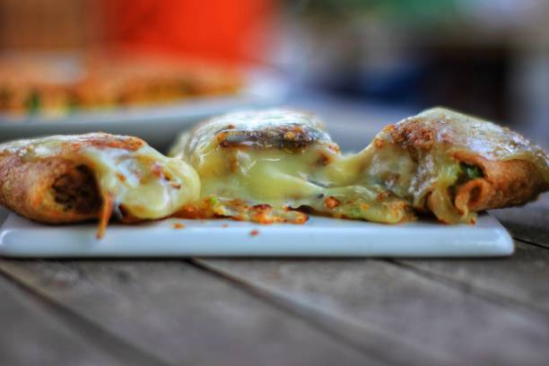 istock Egg martabak with melted mozzarella cheese, looks more tempting. There is a creeping effect with a variety of savory fillings 1286012880