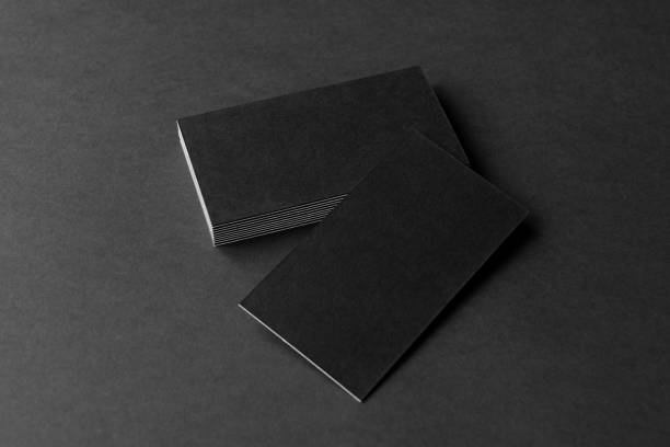 istock Business card on black background. 1286012898