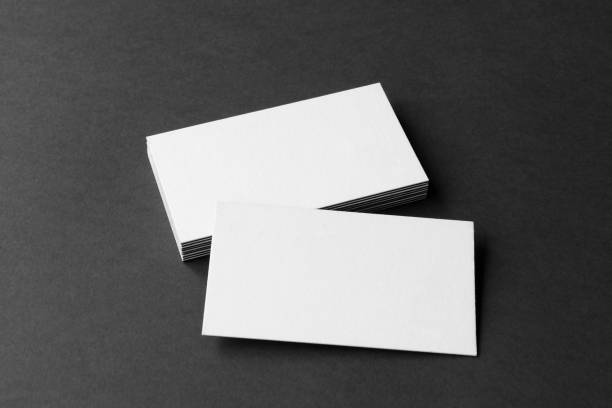 istock Business card on black background. 1286012905