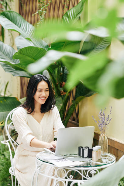 istock Businesswoman sending e-mails 1286013032