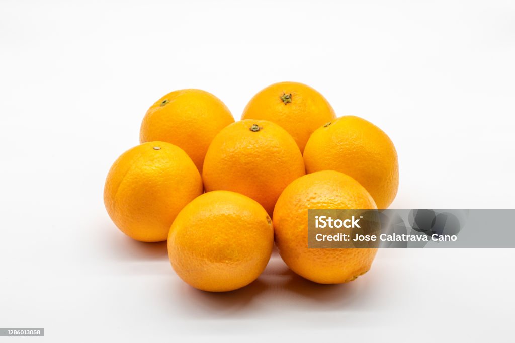 Seven colorful oranges isolated on white background Seven sweet and tasty oranges isolated on white background Valencia Orange Stock Photo