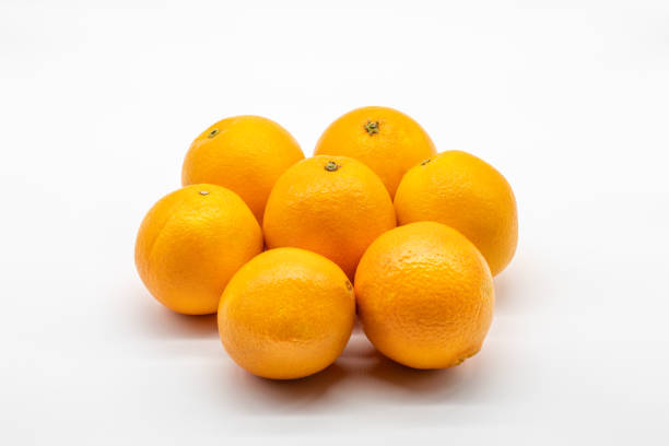 Seven colorful oranges isolated on white background Seven sweet and tasty oranges isolated on white background valencia orange stock pictures, royalty-free photos & images