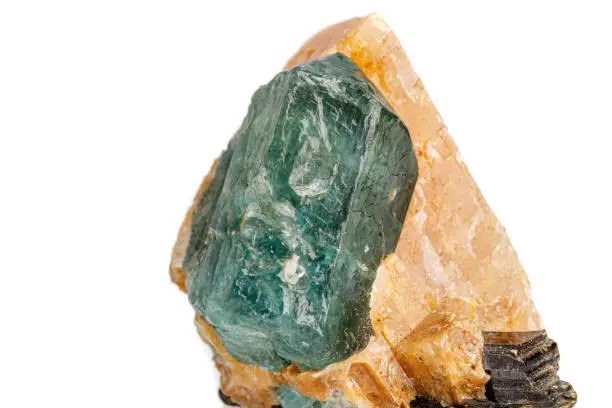 macro stone mineral apatite in calcite on a white background close-up