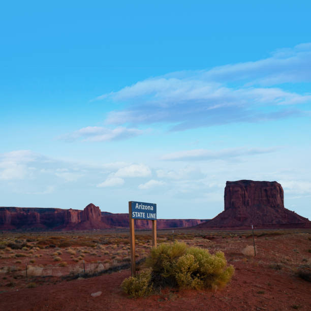 istock Road sign state line Arizona - Monument Valley 1286020742