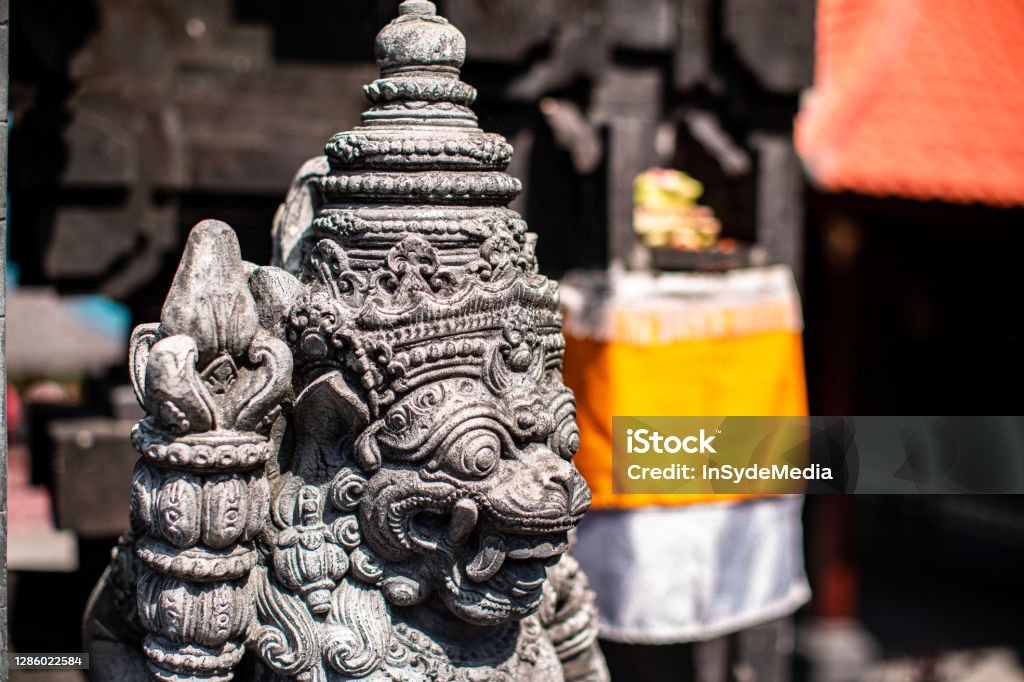 Hindu Statue in Bali Bali, Indonesia - August, 13 2018: In the intricate details of the Hindu statues around Tanah Lot Temple on the island of Bali, Indonesia Ancient Stock Photo