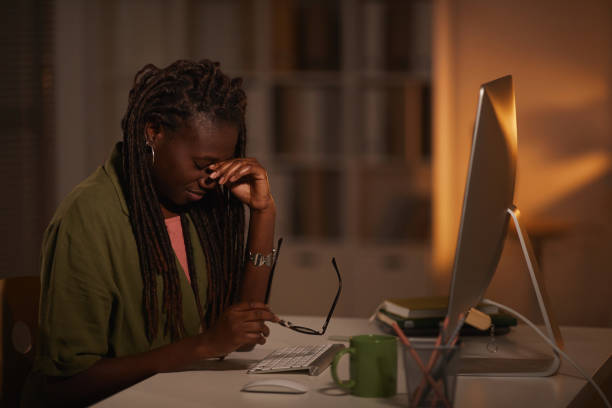 istock Tired African-American Woman at Workplace 1286022857