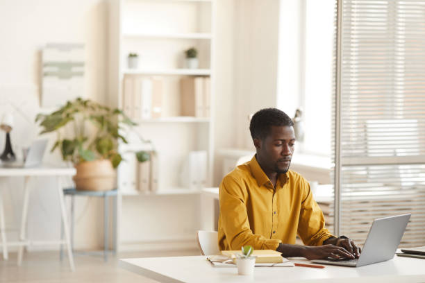 istock African-American Man at Desk in Office 1286022880